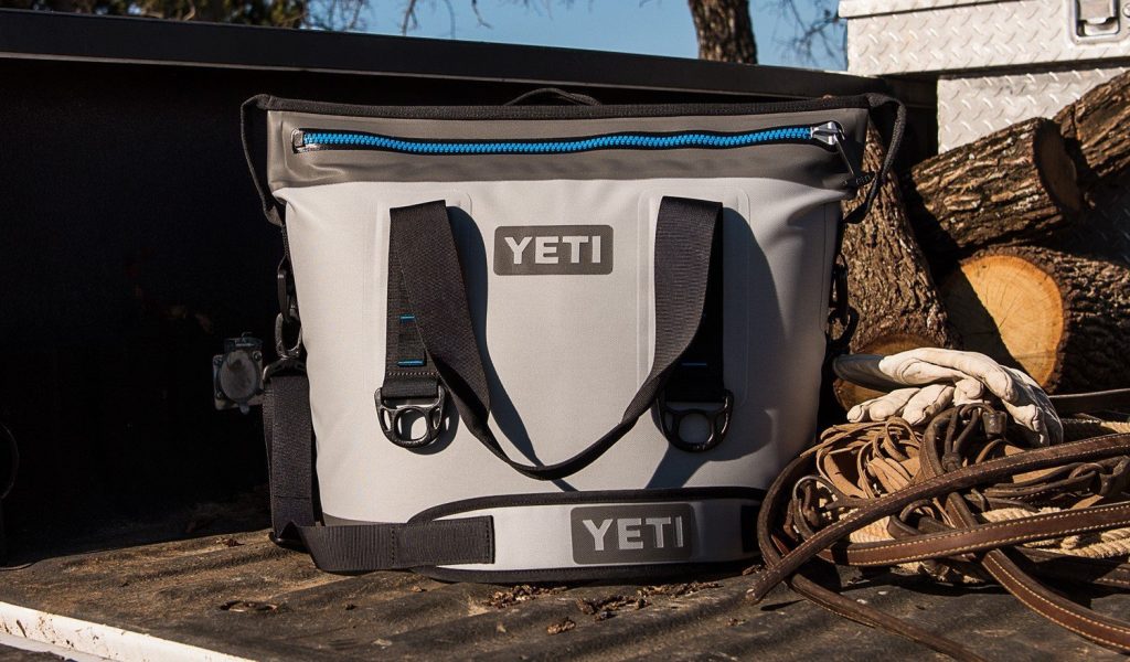 Yeti Hopper soft sided cooler on a wooden deck