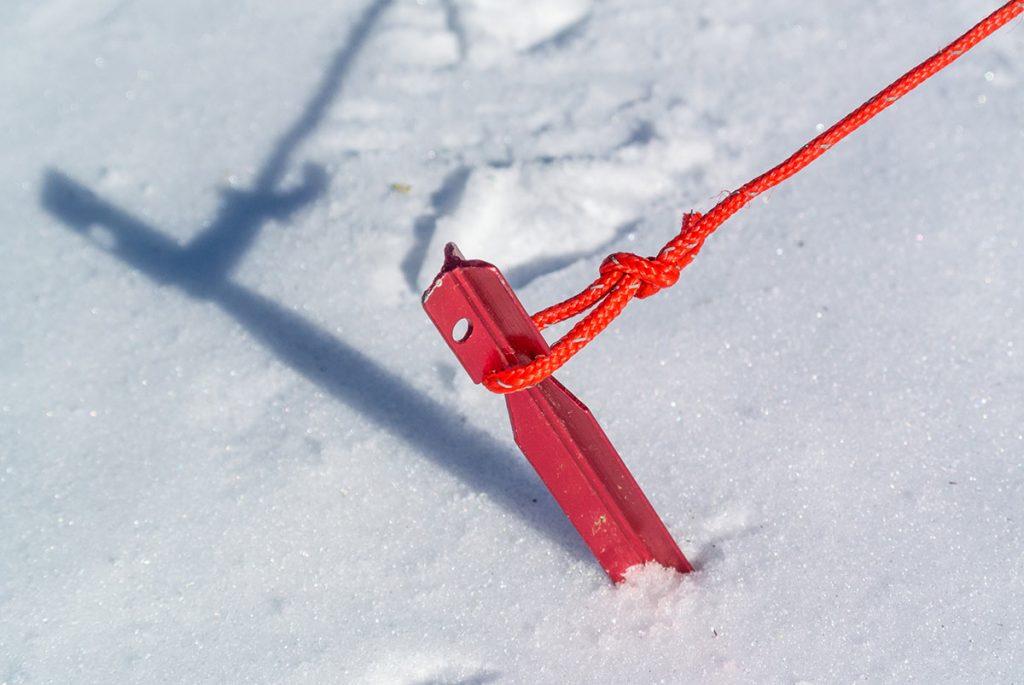 MSR aluminum tent stake in the snow
