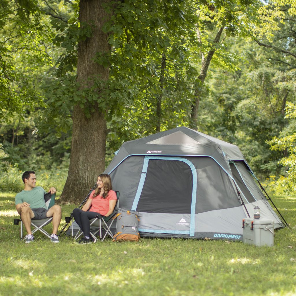Young campers sat outside the Ozark Trail 6 Person Darkrest Tent