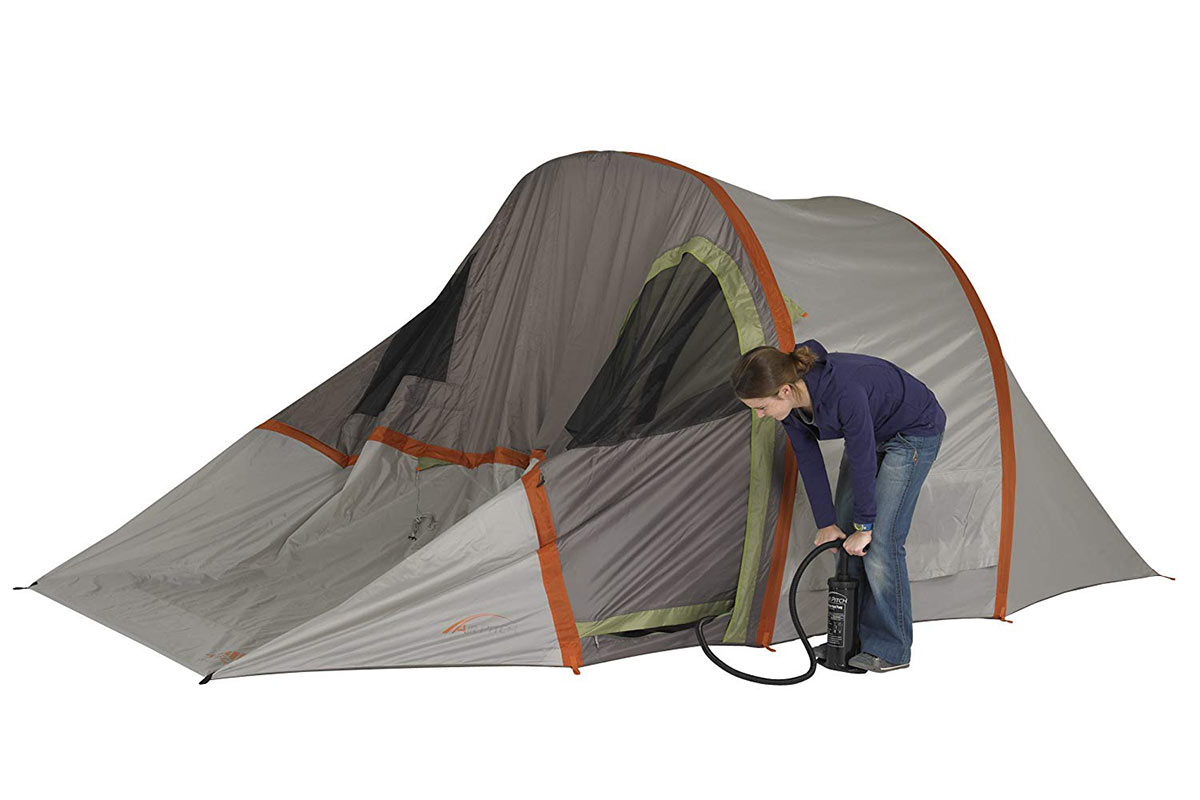 A lady inflates a Kelty Sonic Air Beam Tent